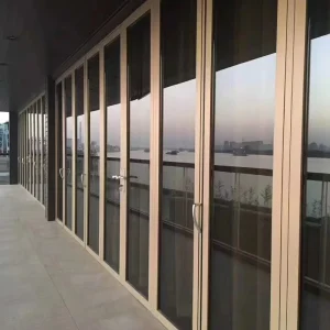 Heavy Duty Bi-Fold Glass Door System with Broken Bridge Insulation, Folding Track, and Exterior School Applications