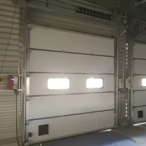 Custom Insulated Steel Industrial Sectional Door with Electric Side Opening and Walk-Through Access
