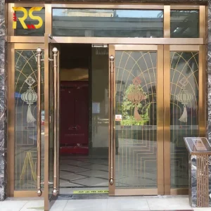 Custom Laser-Cut Stainless Steel and Glass Main Entry Door with Sidelite and Transom for Hotel Lobbies